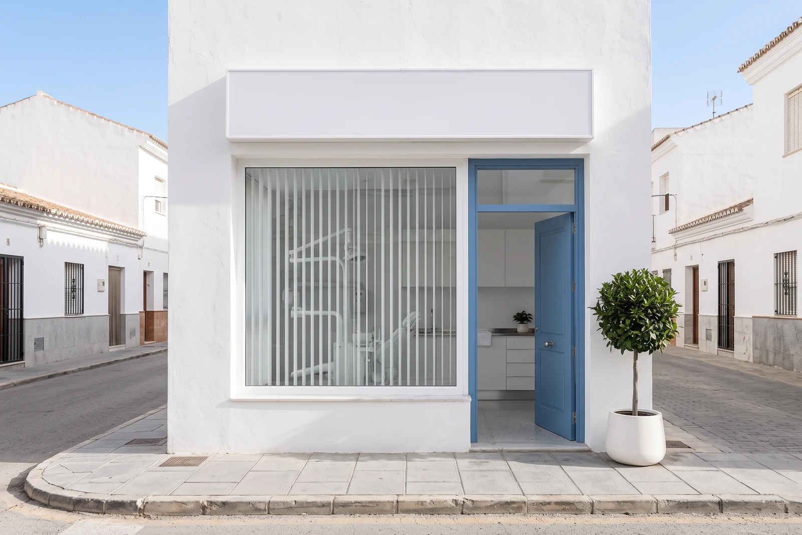 The front of the clinic from the street, with the door standing open.